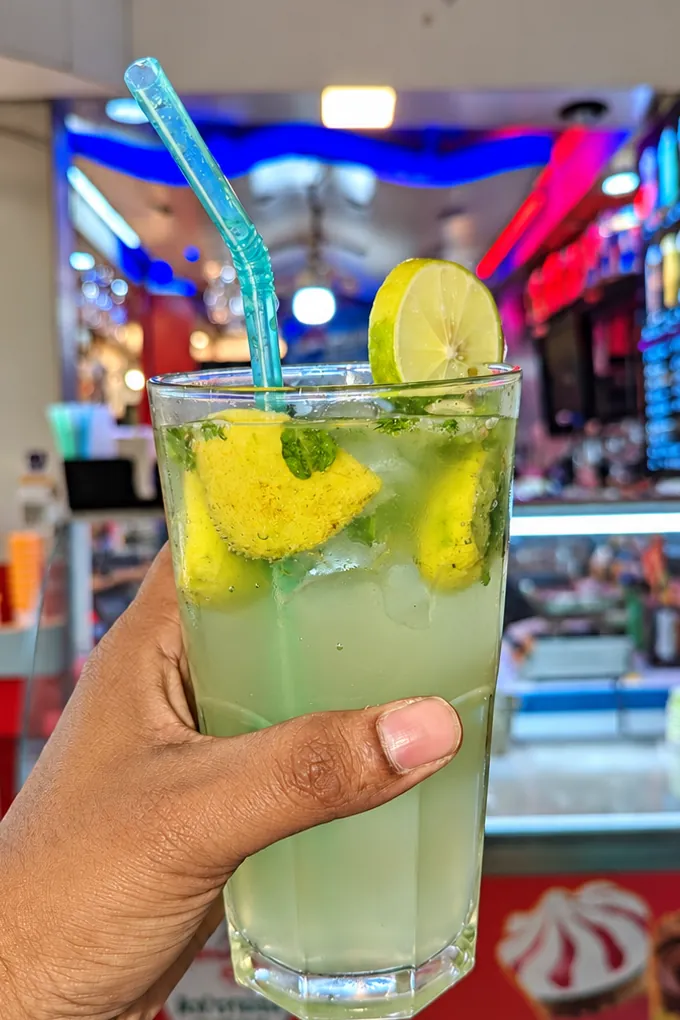 A mojito with lime and mint from the drinks menu at BAR CODE in Prayagraj.