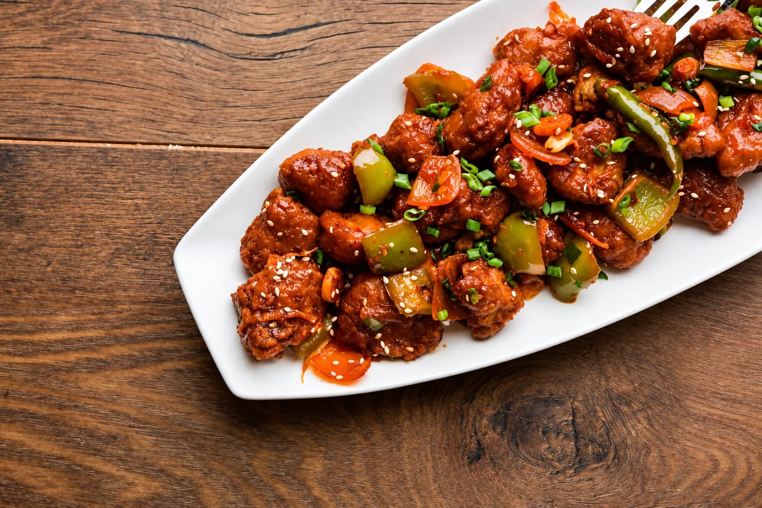 Chilli Chicken with peppers, spring onion and sesame at BAR CODE restaurant in Civil Lines, Prayagraj.