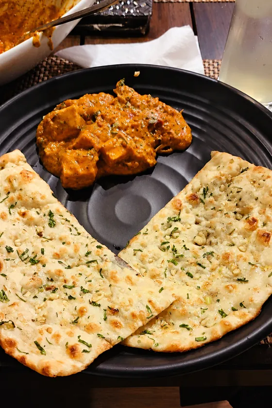 Paneer curry with herbed naan at BAR CODE restaurant in Prayagraj.